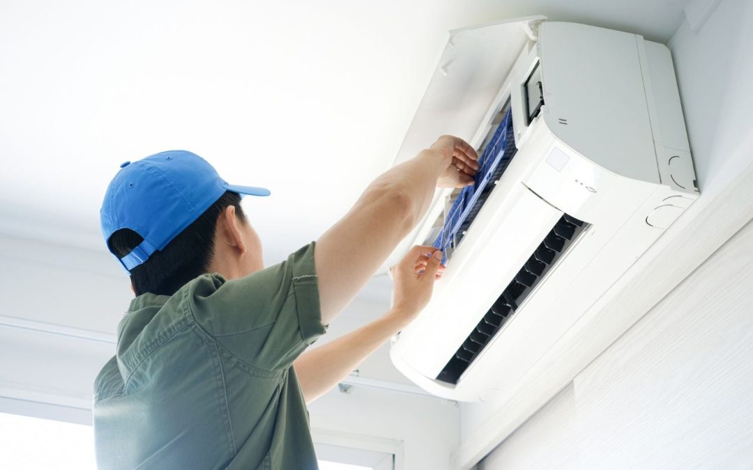 Air conditioning technician maintaining an indoor mini split system in Farmington, UT